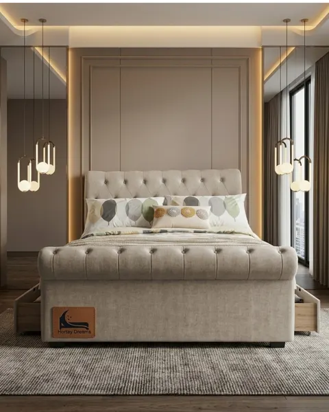 Cream tufted divan bed with storage drawers, styled bedroom with gold accent lighting